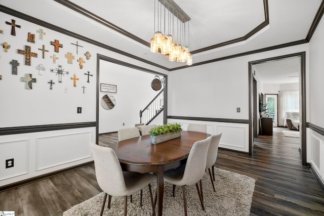 409 Summergreen Way, Greenville, SC 29607 - dining area with dark wood-type flooring, a chandelier, a decorative wall, stairway, and crown molding