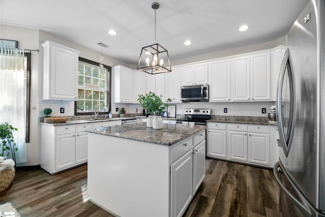 409 Summergreen Way, Greenville, SC 29607 - kitchen featuring stainless steel appliances, dark wood-style flooring, a center island, white cabinetry, and recessed lighting