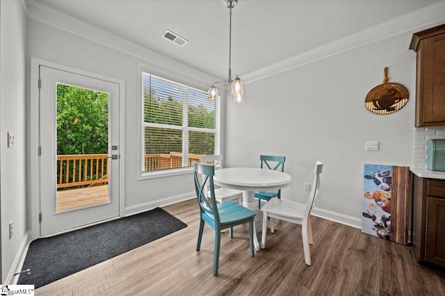 229 Layken Ln, Woodruff, SC 29388 - dining space with dark wood-style floors and crown molding