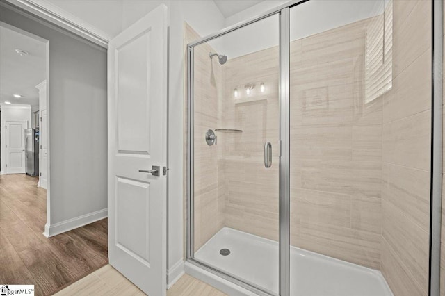 229 Layken Ln, Woodruff, SC 29388 - full bathroom featuring a stall shower and wood finished floors