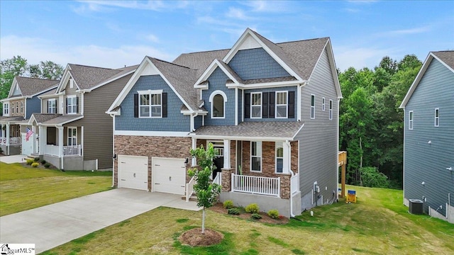 229 Layken Ln, Woodruff, SC 29388 - craftsman-style house featuring a porch, a garage, driveway, and a front yard