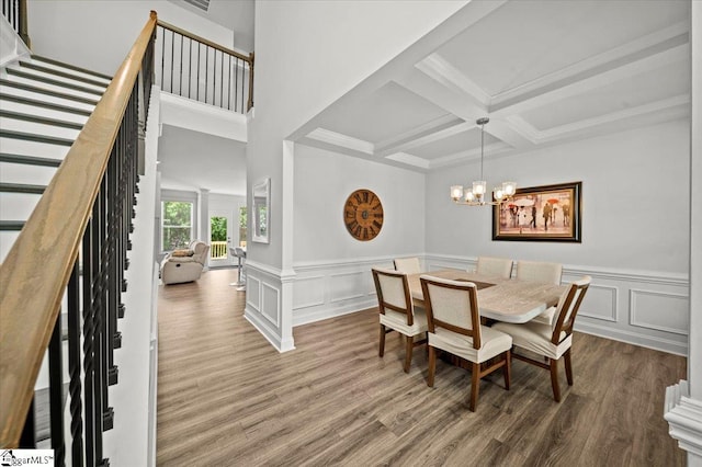 229 Layken Ln, Woodruff, SC 29388 - dining space featuring stairs, wood finished floors, beamed ceiling, coffered ceiling, and a chandelier