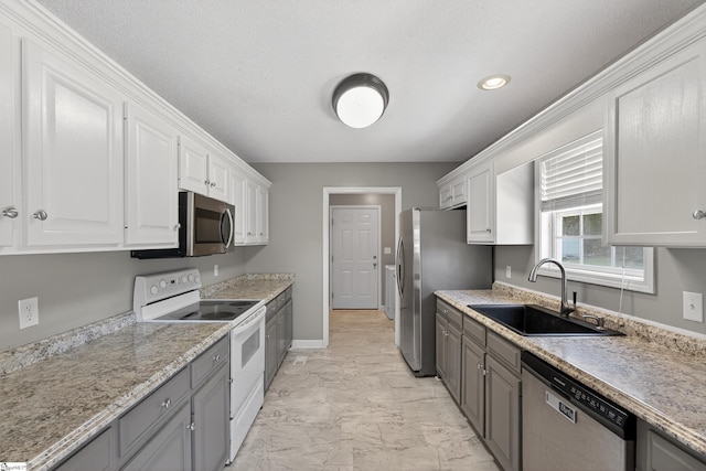 111 Falcon Ln, Chesnee, SC 29323 - kitchen featuring stainless steel appliances, light marble finish floors, white cabinets, gray cabinets, and recessed lighting