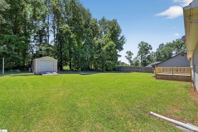 111 Falcon Ln, Chesnee, SC 29323 - view of yard featuring an outdoor structure, a garage, and a wooden deck