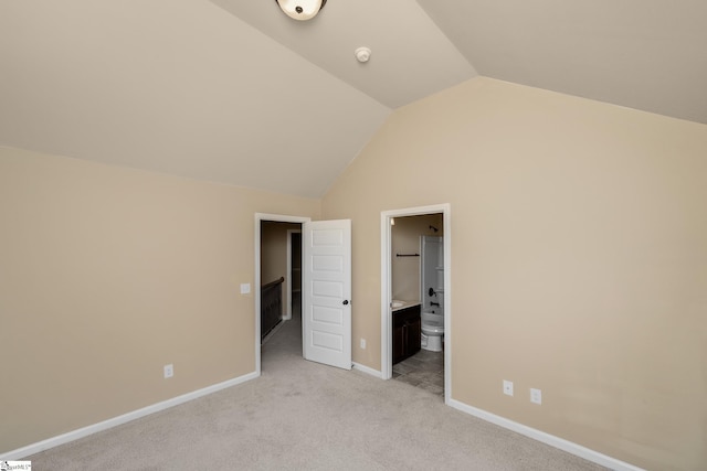 330 Mansfield Ln, Greer, SC 29650 - unfurnished bedroom featuring lofted ceiling, light colored carpet, and ensuite bath