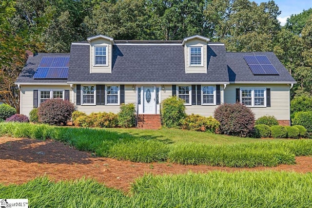 1117 Briarwood Dr, Easley, SC 29642 - view of front of home with solar panels, entry steps, a shingled roof, and a front yard