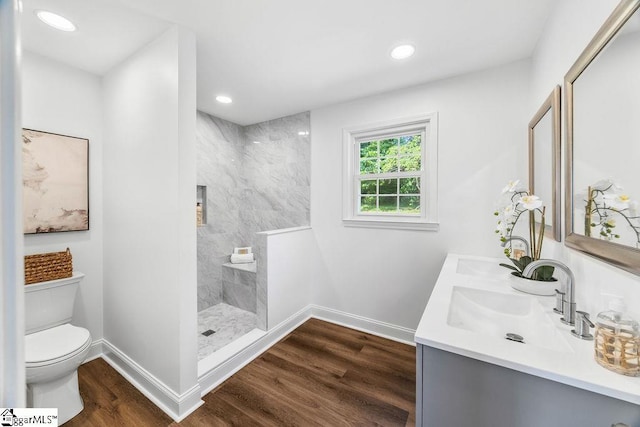 1117 Briarwood Dr, Easley, SC 29642 - bathroom featuring double vanity, walk in shower, wood finished floors, and recessed lighting