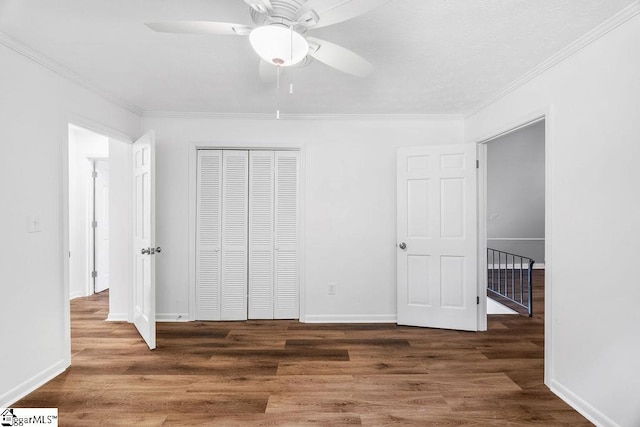 1117 Briarwood Dr, Easley, SC 29642 - unfurnished bedroom featuring a closet, wood finished floors, crown molding, and ceiling fan