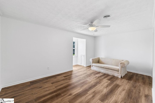 1117 Briarwood Dr, Easley, SC 29642 - sitting room featuring a textured ceiling, a ceiling fan, wood finished floors, and crown molding