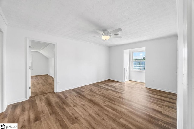 1117 Briarwood Dr, Easley, SC 29642 - spare room with a textured ceiling, ceiling fan, wood finished floors, and crown molding