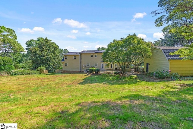1117 Briarwood Dr, Easley, SC 29642 - rear view of property featuring a yard and roof mounted solar panels