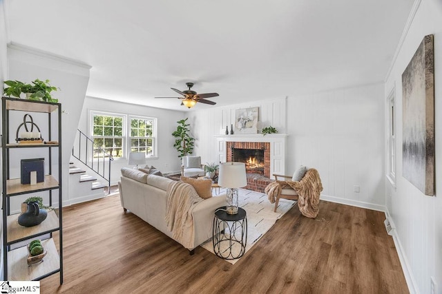 1117 Briarwood Dr, Easley, SC 29642 - living room featuring stairs, a brick fireplace, wood finished floors, and a ceiling fan