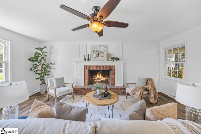 1117 Briarwood Dr, Easley, SC 29642 - living area with wood finished floors, a brick fireplace, ceiling fan, and ornamental molding
