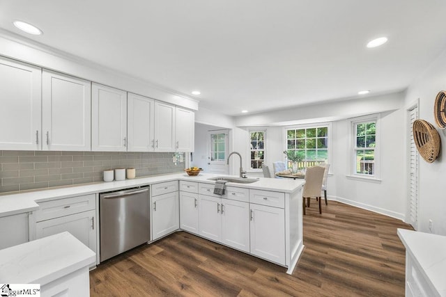 1117 Briarwood Dr, Easley, SC 29642 - kitchen with stainless steel dishwasher, a peninsula, recessed lighting, light countertops, and dark wood-type flooring