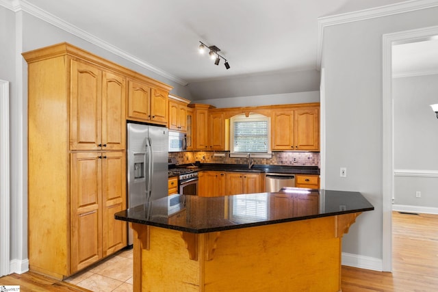 108 Goldenstar Ln, Greer, SC 29651 - kitchen with stainless steel appliances, a kitchen breakfast bar, tasteful backsplash, dark stone countertops, and light wood-style flooring