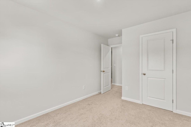118 Randwick Ln, Greer, SC 29651 - unfurnished bedroom featuring light colored carpet and baseboards