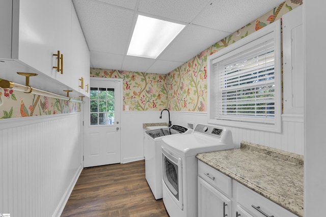 26 Tranquil Ave, Greenville, SC 29615 - laundry area with wallpapered walls, a wainscoted wall, separate washer and dryer, dark wood-style flooring, and cabinet space