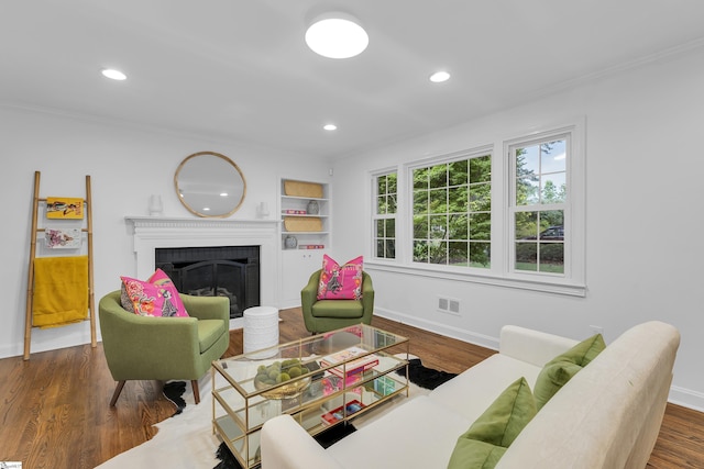 26 Tranquil Ave, Greenville, SC 29615 - living area with ornamental molding, a brick fireplace, recessed lighting, wood finished floors, and built in features