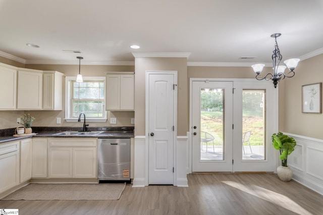 121 Stanmoore Dr, Anderson, SC 29621 - kitchen featuring stainless steel dishwasher, light wood-style flooring, dark countertops, ornamental molding, and hanging light fixtures