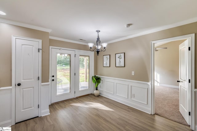121 Stanmoore Dr, Anderson, SC 29621 - unfurnished dining area featuring a chandelier, wood finished floors, and crown molding