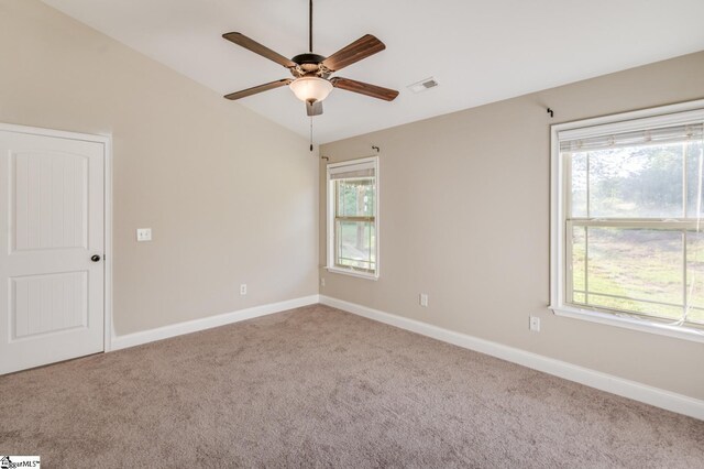 121 Stanmoore Dr, Anderson, SC 29621 - empty room featuring carpet flooring, ceiling fan, healthy amount of natural light, and vaulted ceiling