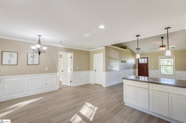 121 Stanmoore Dr, Anderson, SC 29621 - kitchen featuring hanging light fixtures, a chandelier, a ceiling fan, a decorative wall, and crown molding