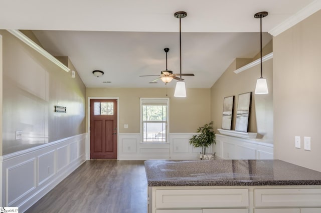 121 Stanmoore Dr, Anderson, SC 29621 - kitchen with ceiling fan, a decorative wall, white cabinets, wood finished floors, and vaulted ceiling
