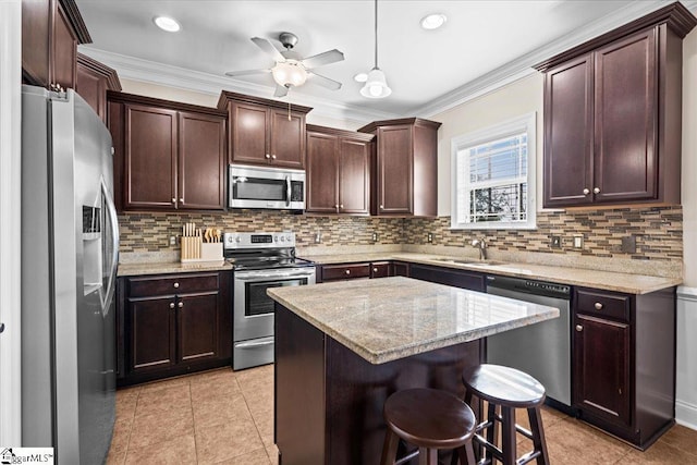 124 Alberta Cir, Piedmont, SC 29673 - kitchen with stainless steel appliances, dark brown cabinetry, backsplash, a ceiling fan, and crown molding