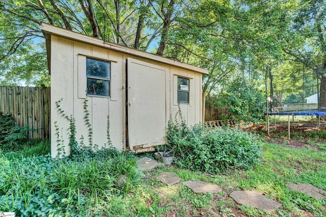 203 Camellia Ln, Simpsonville, SC 29681 - view of shed with a trampoline and a fenced backyard