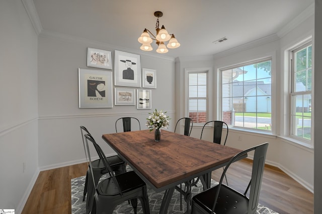 101 Clearbrook Ct, Greer, SC 29650 - dining space featuring wood finished floors, crown molding, and a chandelier