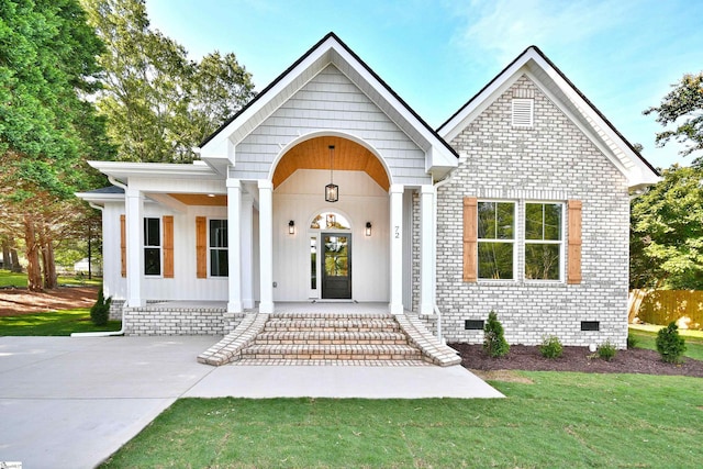 72 Seminole Dr, Simpsonville, SC 29680 - view of front facade featuring brick siding, covered porch, crawl space, and a front yard