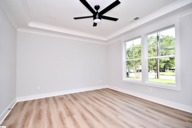 72 Seminole Dr, Simpsonville, SC 29680 - spare room with ornamental molding, light wood-type flooring, a tray ceiling, and ceiling fan