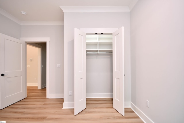72 Seminole Dr, Simpsonville, SC 29680 - unfurnished bedroom with light wood-style flooring, crown molding, and a closet