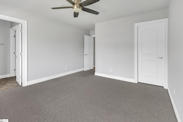 528 Carolee Way, Greer, SC 29651 - unfurnished bedroom with dark colored carpet and a ceiling fan