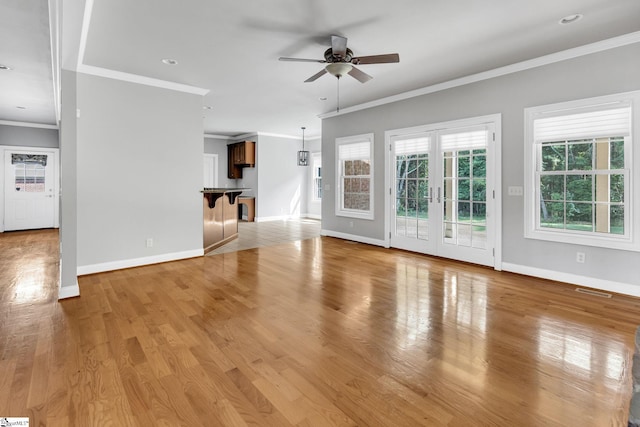 528 Carolee Way, Greer, SC 29651 - unfurnished living room with ceiling fan, crown molding, light wood finished floors, french doors, and recessed lighting