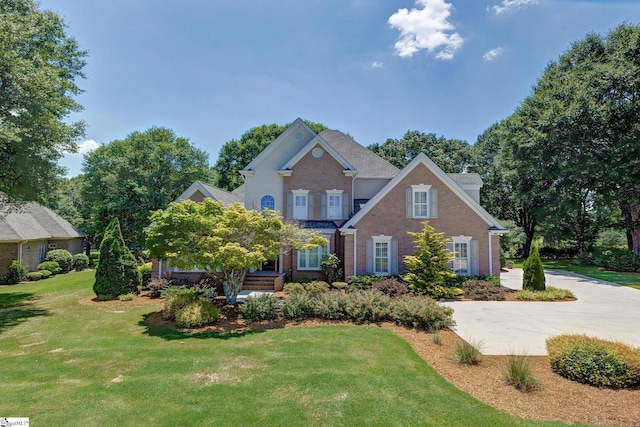 163 Tupelo Dr, Greer, SC 29651 - view of front of house with brick siding and a front yard