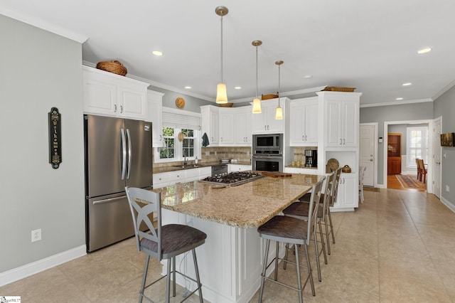 163 Tupelo Dr, Greer, SC 29651 - kitchen featuring appliances with stainless steel finishes, recessed lighting, decorative backsplash, crown molding, and white cabinets