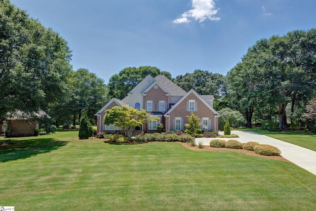 163 Tupelo Dr, Greer, SC 29651 - traditional home with a front lawn and brick siding
