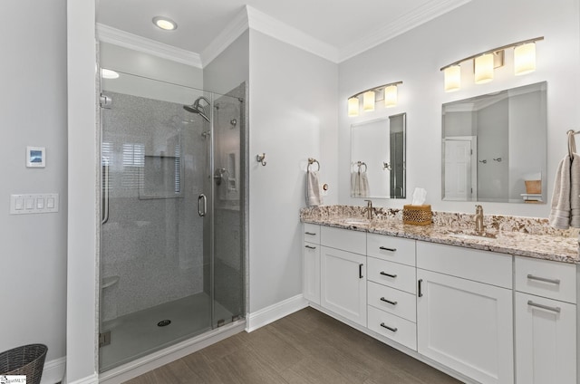 163 Tupelo Dr, Greer, SC 29651 - full bathroom featuring double vanity, a stall shower, wood finished floors, crown molding, and recessed lighting
