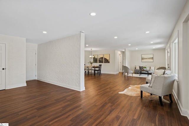 223 Speedway Dr, Fountain Inn, SC 29644 - living area with wood finished floors, recessed lighting, brick wall, and a chandelier