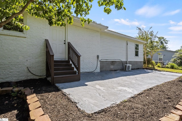 223 Speedway Dr, Fountain Inn, SC 29644 - view of side of property with brick siding and a patio area
