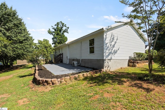 223 Speedway Dr, Fountain Inn, SC 29644 - view of property exterior featuring a patio area and a yard