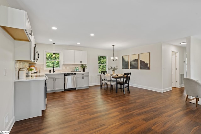 223 Speedway Dr, Fountain Inn, SC 29644 - kitchen featuring dishwasher, dark wood finished floors, light countertops, plenty of natural light, and recessed lighting