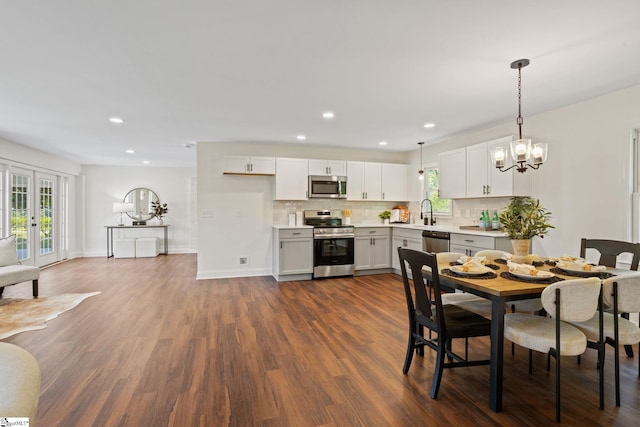 223 Speedway Dr, Fountain Inn, SC 29644 - dining room with healthy amount of natural light, dark wood-type flooring, recessed lighting, a chandelier, and french doors
