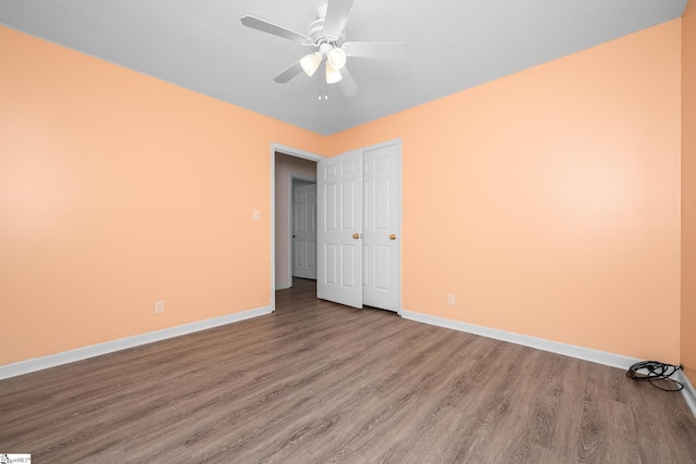 908 Harness Trl, Greenville, SC 29681 - unfurnished bedroom featuring wood finished floors, ceiling fan, and a closet