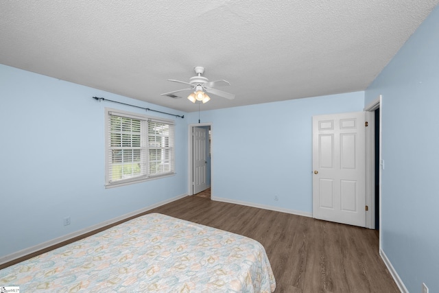 908 Harness Trl, Greenville, SC 29681 - bedroom with wood finished floors, a textured ceiling, and ceiling fan