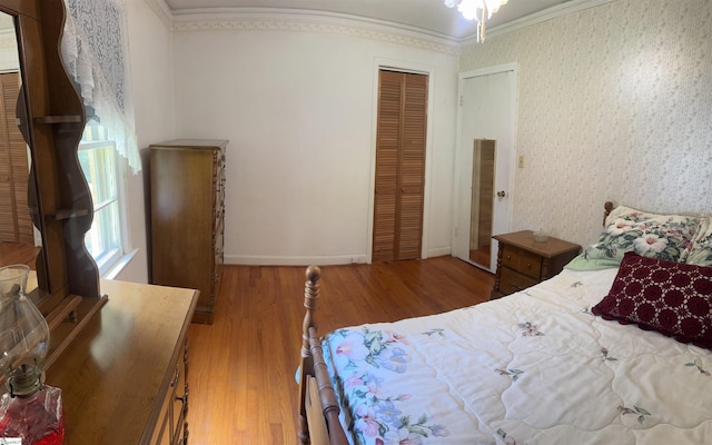 228 Styles Rd, Taylors, SC 29687 - bedroom with ornamental molding, wood finished floors, a closet, and wallpapered walls