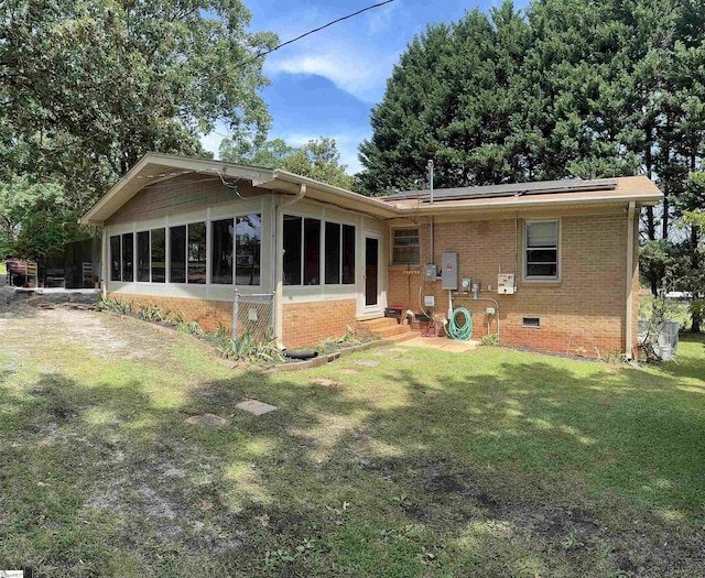 228 Styles Rd, Taylors, SC 29687 - rear view of property with brick siding, a lawn, a sunroom, and crawl space