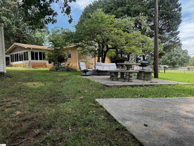 228 Styles Rd, Taylors, SC 29687 - view of grassy yard with a patio area, a sunroom, and an outdoor hangout area
