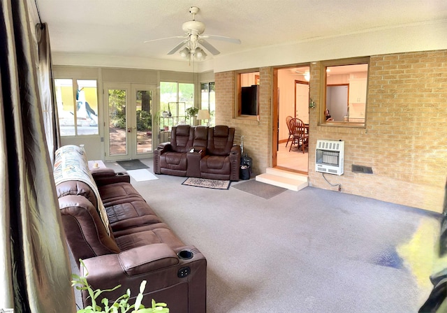 228 Styles Rd, Taylors, SC 29687 - carpeted living area with heating unit, a ceiling fan, french doors, and brick wall